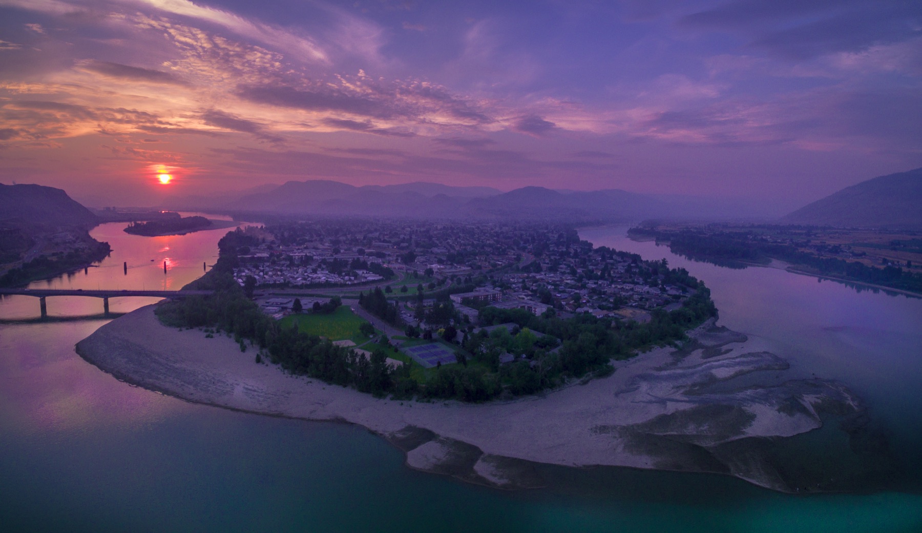 Aerial view of Kamloops at sunset showing the North Shore and Thompson River.