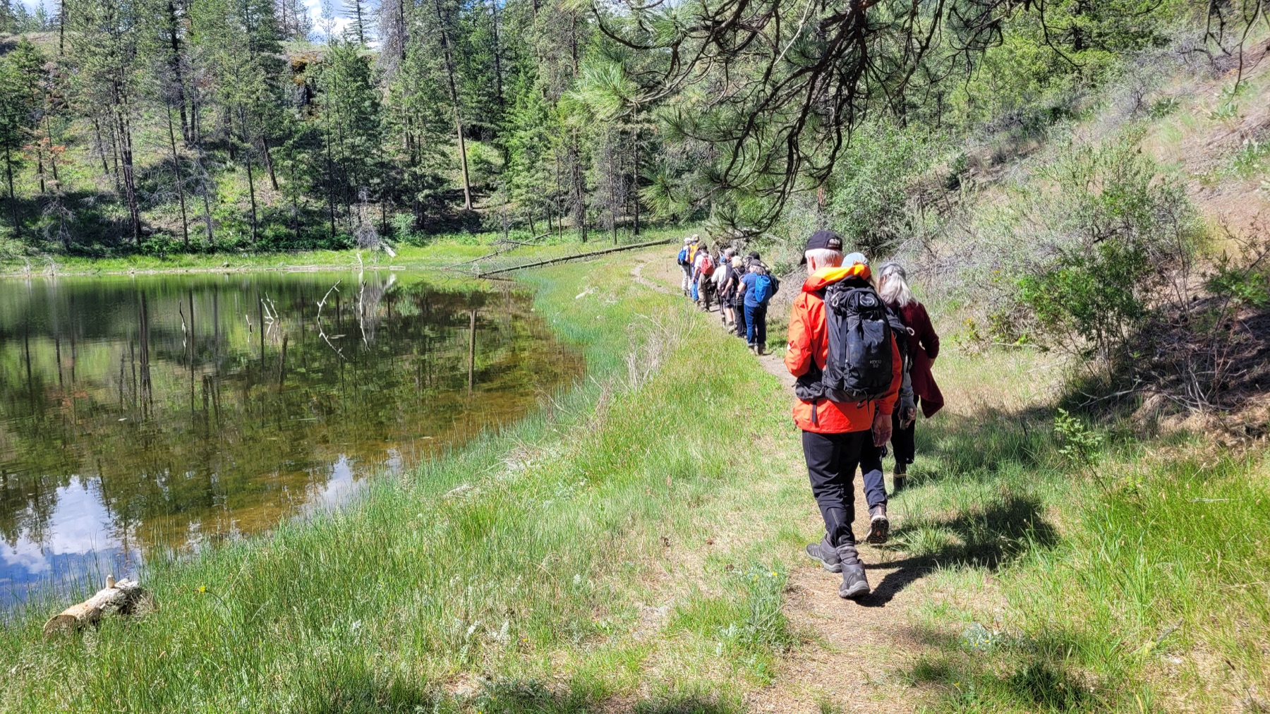 A group hiking beside Mahoney Lake near Penticton.